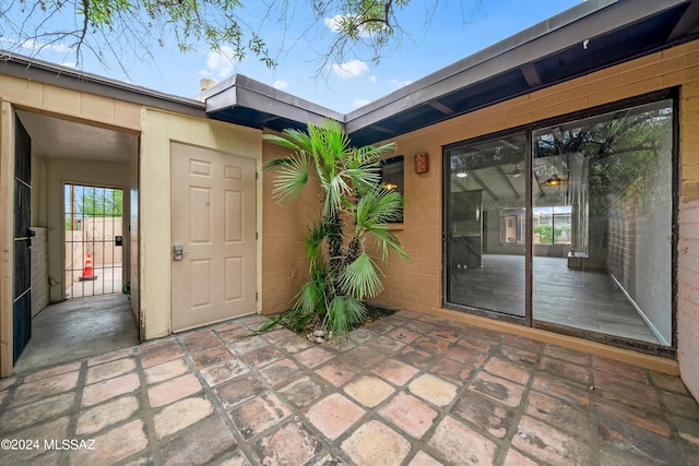 entrance to property with a patio