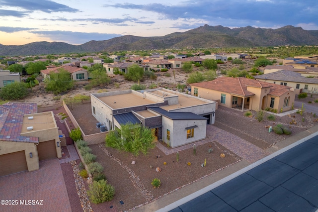 drone / aerial view featuring a mountain view and a residential view