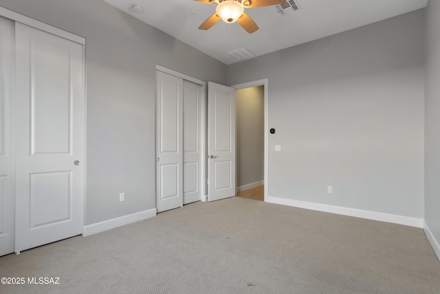 unfurnished bedroom featuring visible vents, ceiling fan, baseboards, and carpet floors