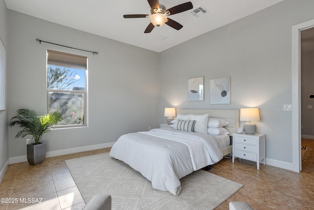 tiled bedroom featuring baseboards, visible vents, and ceiling fan