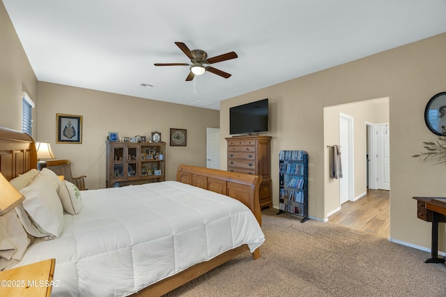 bedroom featuring carpet flooring, visible vents, baseboards, and ceiling fan