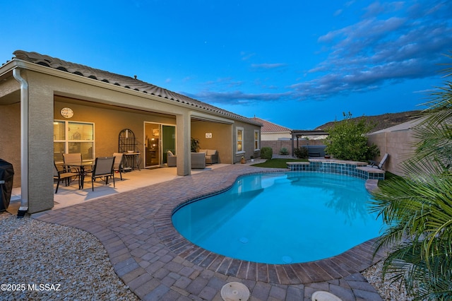 view of swimming pool with outdoor dining area, a patio area, a fenced in pool, and a fenced backyard