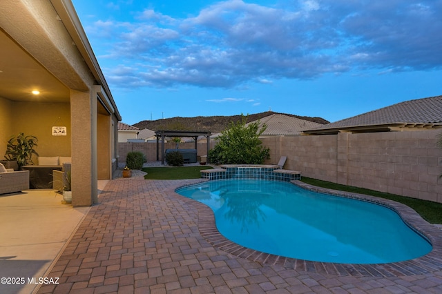 view of swimming pool featuring a patio area, a fenced in pool, a pergola, and a fenced backyard