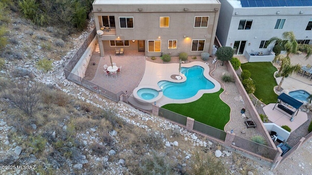 view of swimming pool with a fenced in pool, a fenced backyard, and a patio area