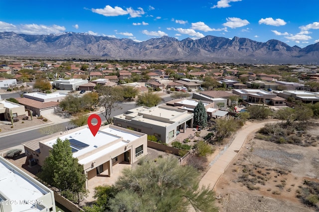 drone / aerial view featuring a mountain view and a residential view