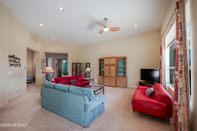 carpeted living room featuring visible vents, recessed lighting, a ceiling fan, and baseboards