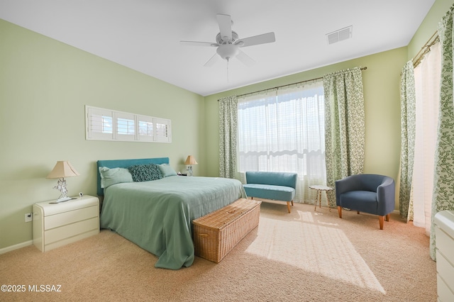 bedroom with visible vents, a ceiling fan, baseboards, and carpet floors