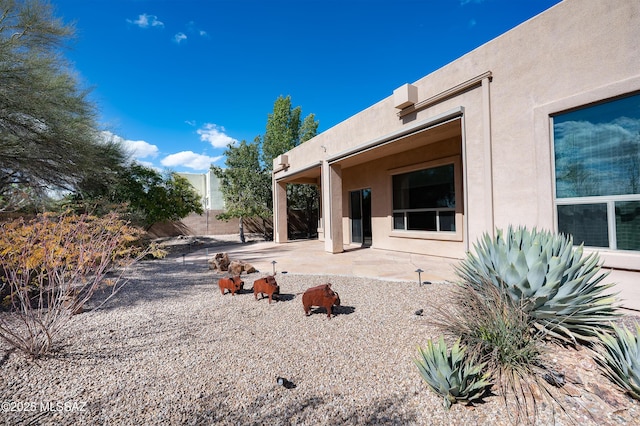 exterior space with a patio and fence