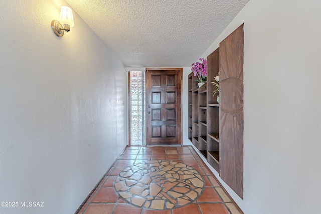 entryway featuring a textured ceiling