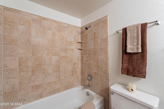 bathroom featuring toilet and shower / bath combination