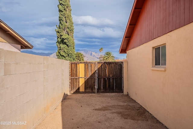 view of yard with a mountain view and fence