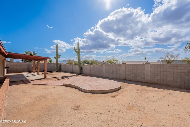 view of yard with a patio and a fenced backyard