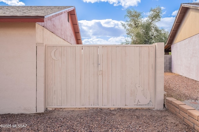 view of gate featuring fence