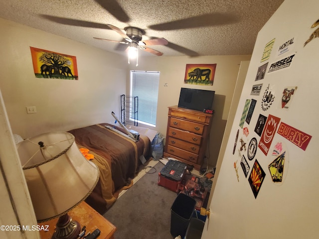 bedroom featuring a textured ceiling, ceiling fan, and carpet flooring