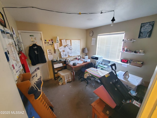 home office featuring concrete floors