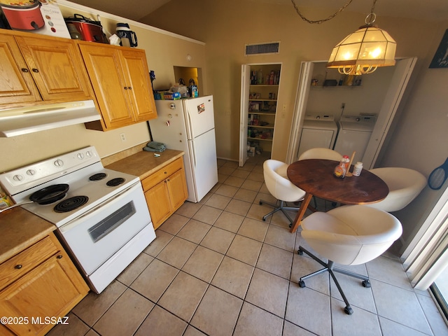 kitchen with visible vents, light tile patterned floors, range hood, independent washer and dryer, and white appliances