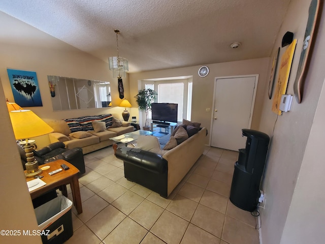 living area featuring light tile patterned floors and a textured ceiling