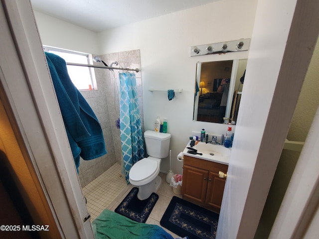 full bathroom featuring vanity, toilet, a shower stall, and tile patterned flooring