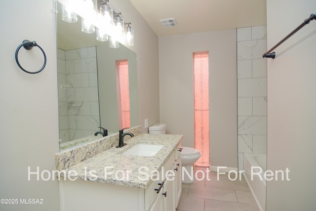 bathroom with tile patterned floors, visible vents, toilet, baseboards, and vanity