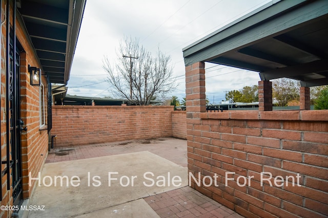 view of patio with fence