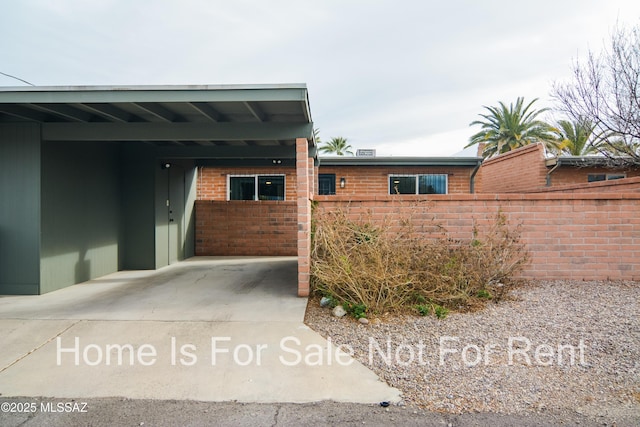 view of front facade with a carport