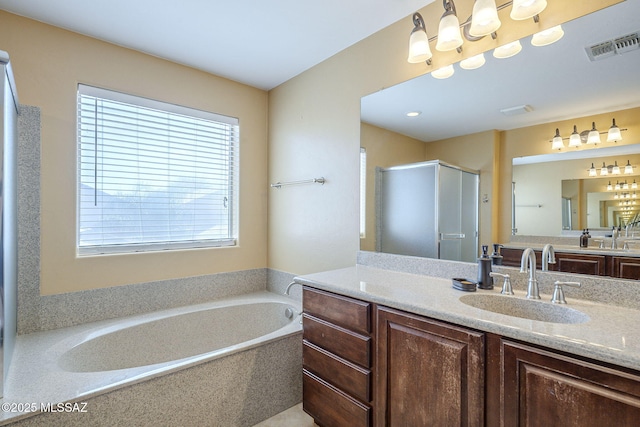 full bathroom with vanity, visible vents, a bath, and a stall shower