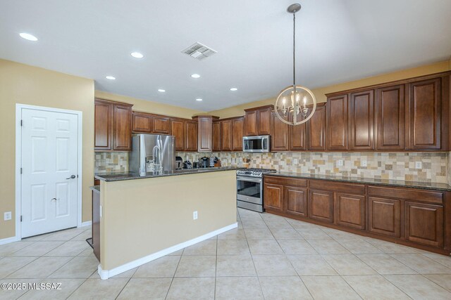 kitchen with visible vents, light tile patterned flooring, tasteful backsplash, a notable chandelier, and stainless steel appliances