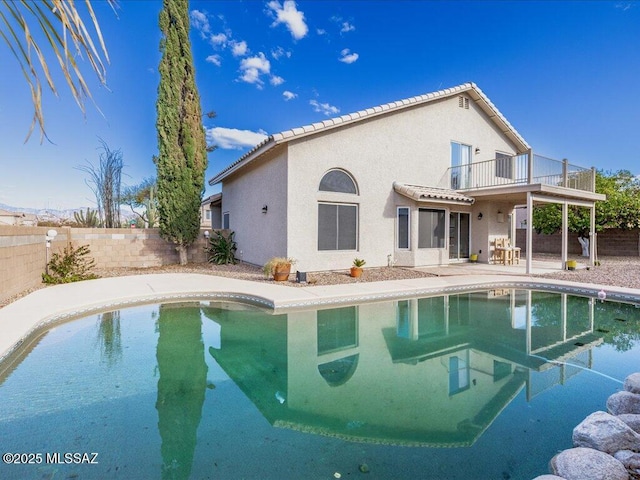 view of swimming pool featuring a patio, a fenced backyard, and a fenced in pool