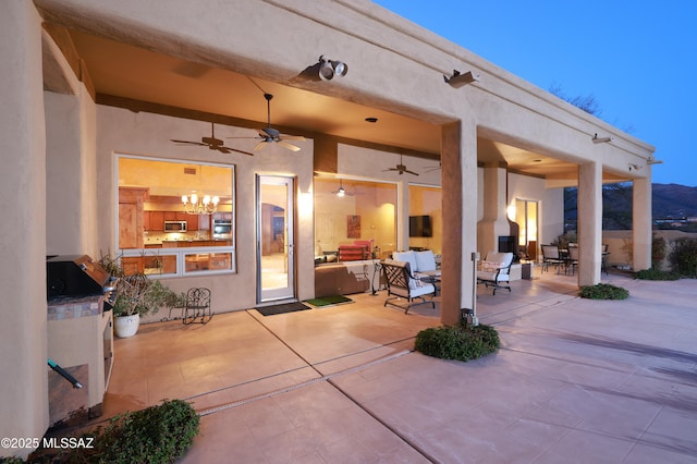 view of patio with ceiling fan