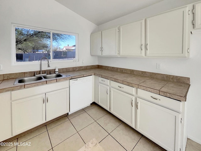 kitchen with white cabinetry, lofted ceiling, white dishwasher, and a sink