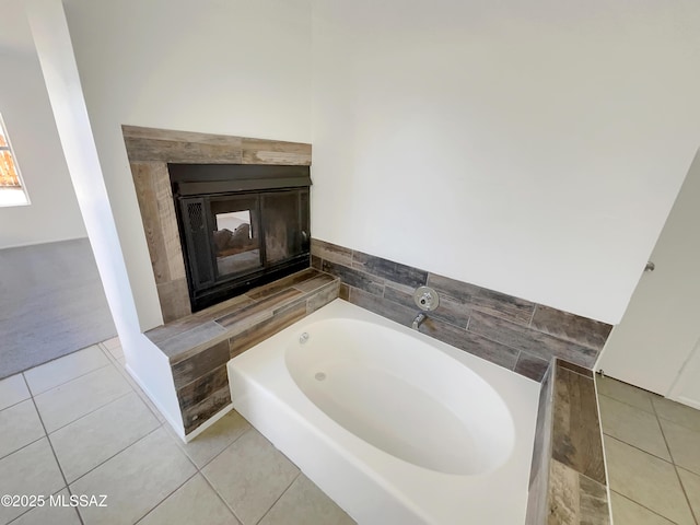 bathroom featuring tile patterned flooring and a bath