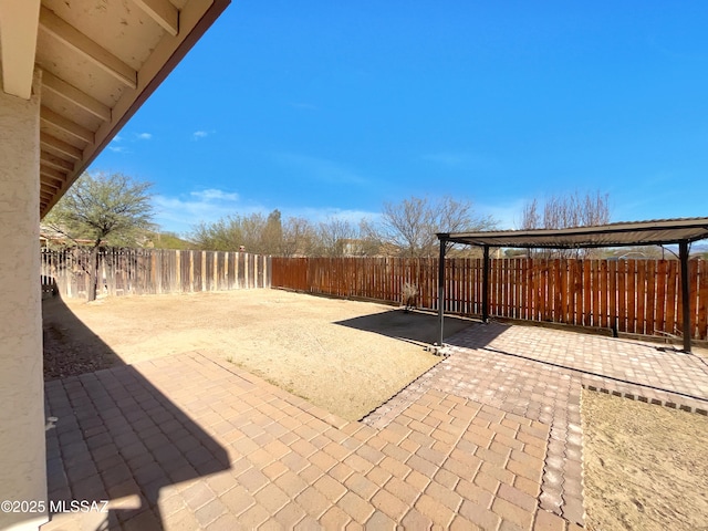 view of patio / terrace with a fenced backyard and a pergola