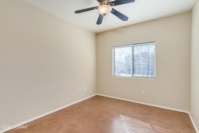 spare room featuring carpet, baseboards, and ceiling fan