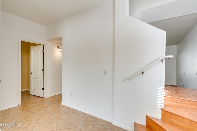 interior space with tile patterned flooring and baseboards