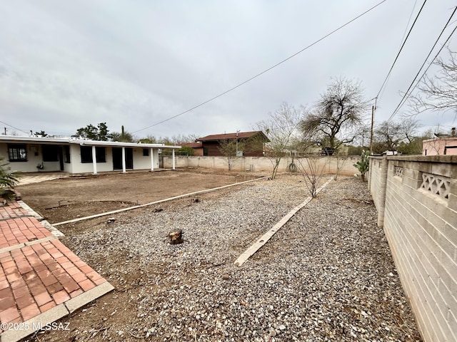 view of yard featuring a patio and a fenced backyard