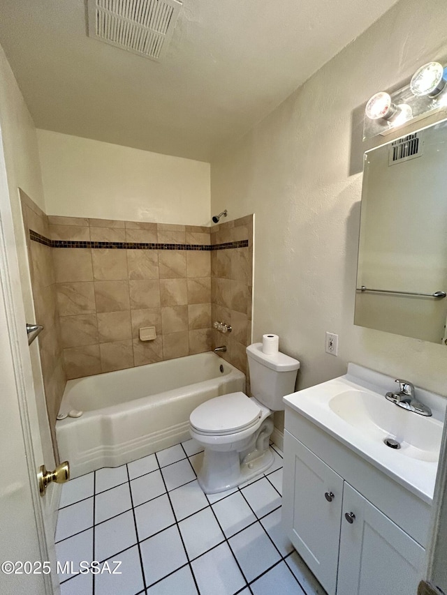bathroom with vanity, tile patterned floors, toilet, and visible vents