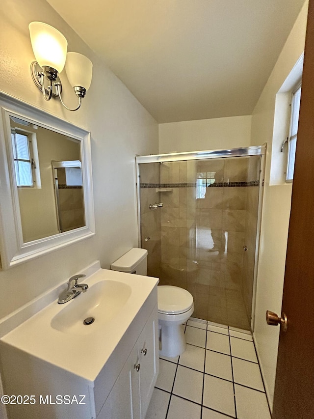 full bathroom with tile patterned floors, a shower stall, toilet, and vanity