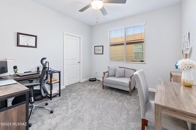 office space featuring carpet flooring, baseboards, and ceiling fan