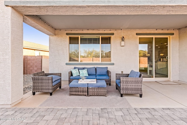 view of patio with outdoor lounge area and fence