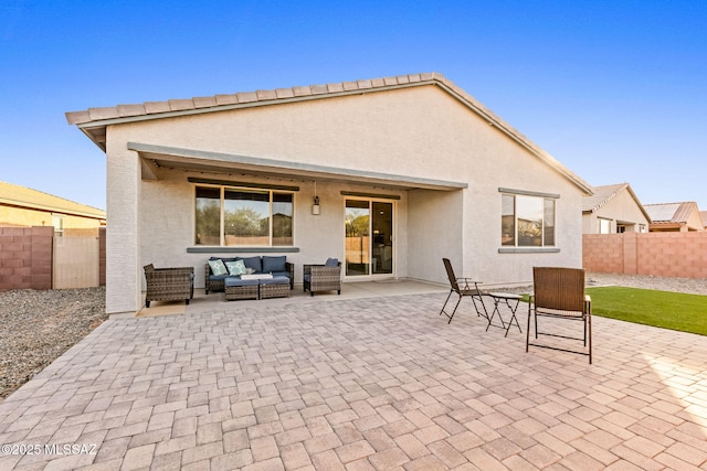 view of patio with an outdoor hangout area and fence