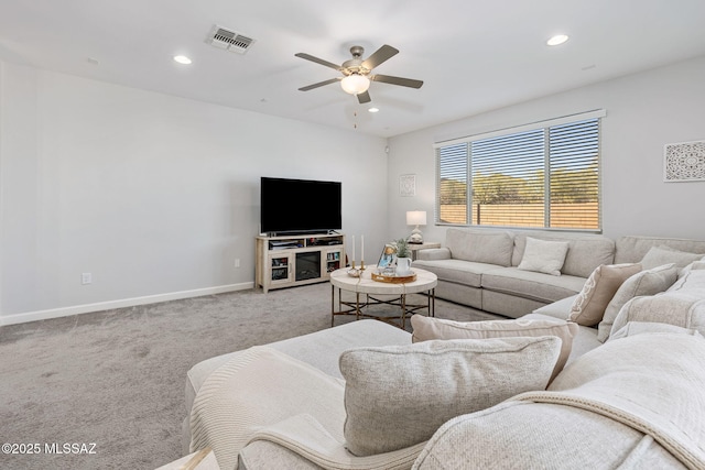 living room featuring baseboards, visible vents, recessed lighting, ceiling fan, and light colored carpet