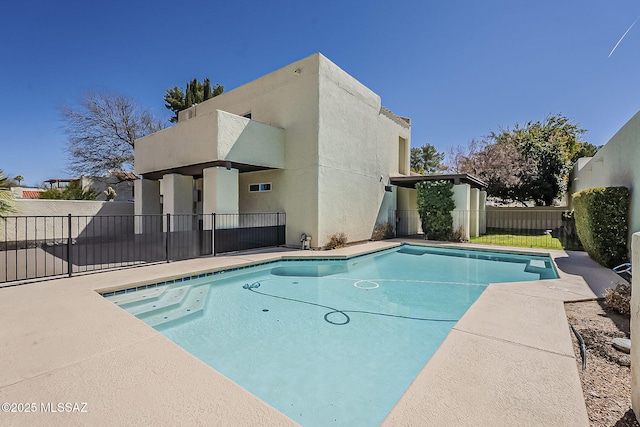 view of pool with a patio, fence, and a fenced in pool