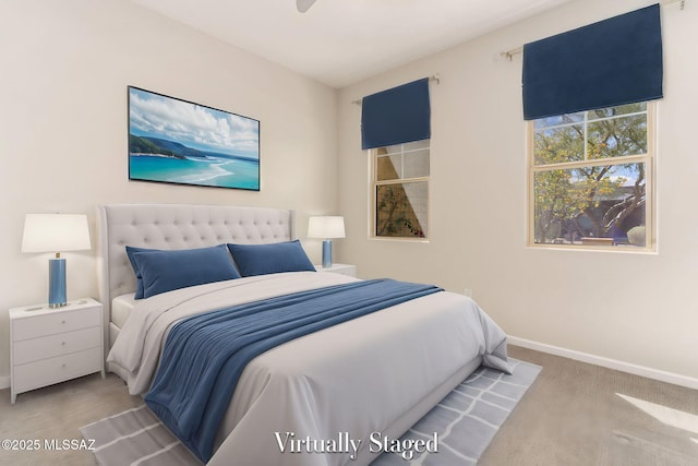 carpeted bedroom with baseboards