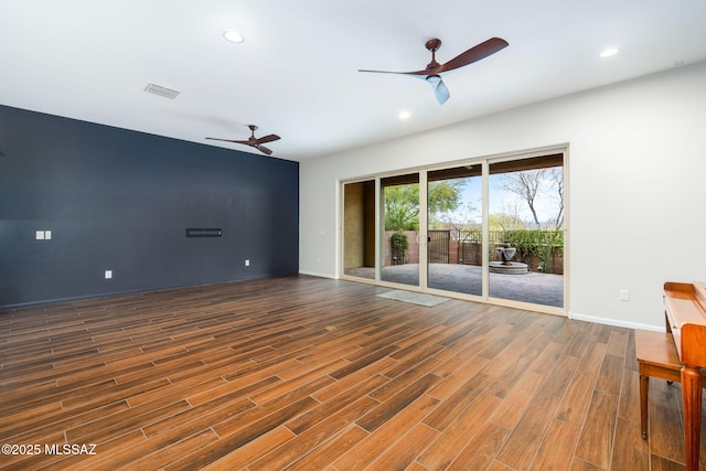 unfurnished room featuring recessed lighting, wood finished floors, visible vents, and ceiling fan