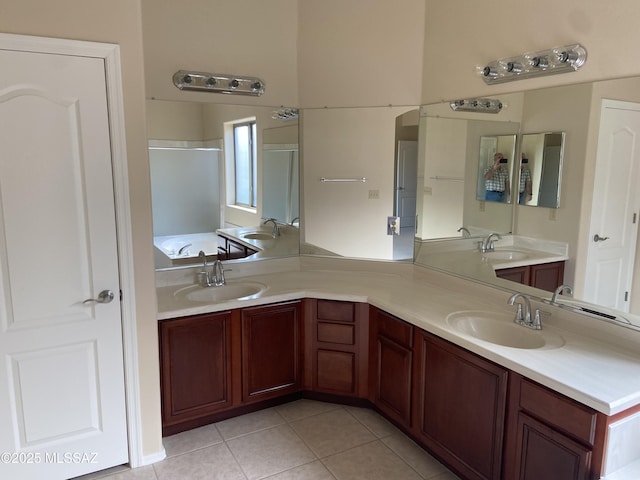 full bathroom with a sink and double vanity