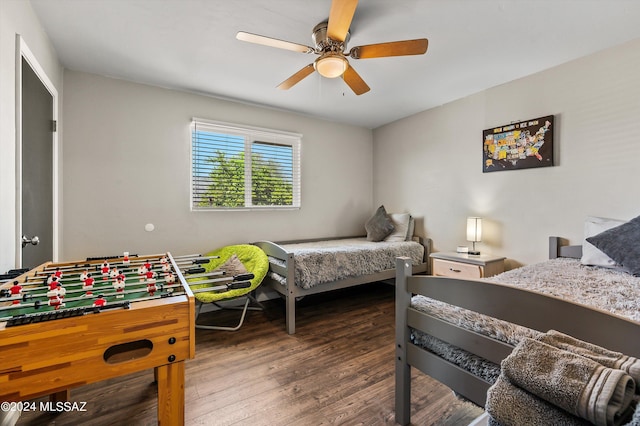 bedroom featuring a ceiling fan and wood finished floors