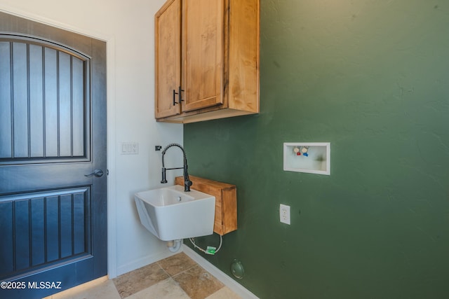 bathroom featuring a sink and baseboards