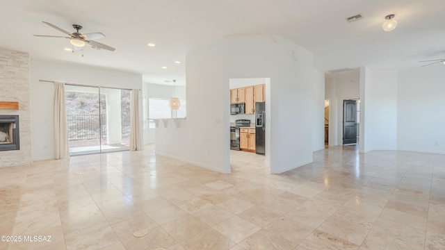 unfurnished living room with baseboards, visible vents, recessed lighting, a fireplace, and ceiling fan