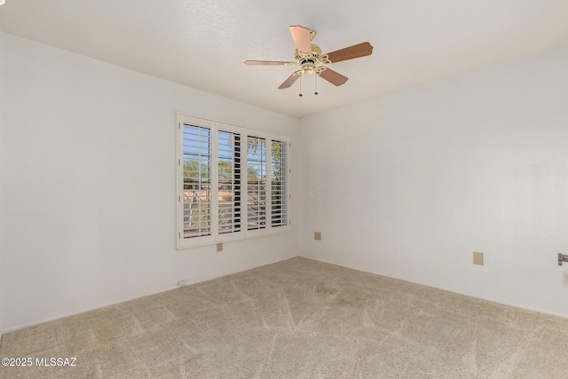 unfurnished room featuring carpet floors and ceiling fan
