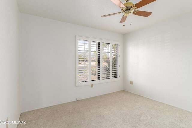 empty room with carpet floors and ceiling fan